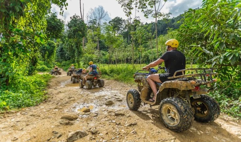 ATV riding on dirt road to the Big Buddha in Phuket-Thailand