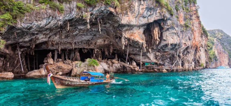 A fisherman boat by viking cave at Phi Phi Island-Thailand