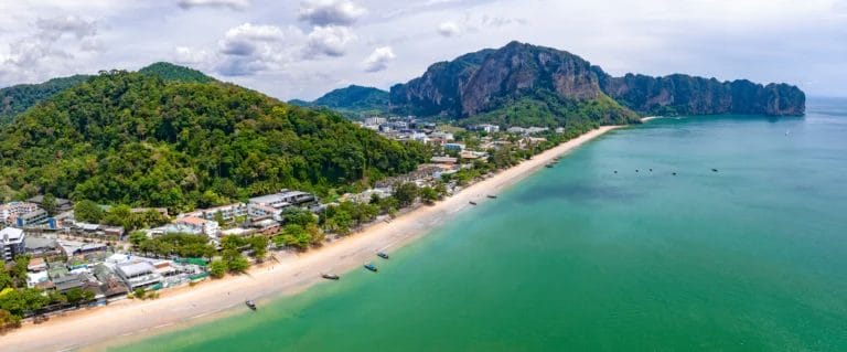 Haat Nopparat Thara Beach-Ao Nang Beach-long beach along with properties, big mountains and boats in a nice day