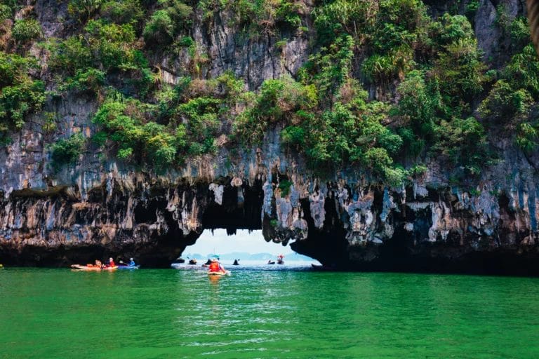 Kayaking through giant limestone cave island in Phang Nga Bay- Thailand