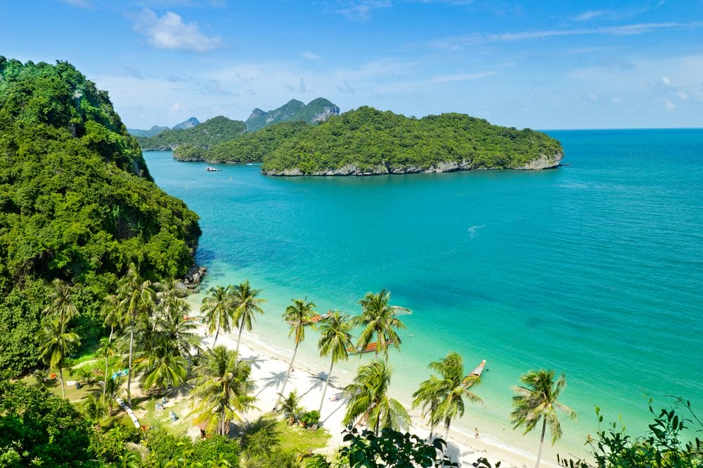 Sandy beach with coconut trees, islands of Ko-Wua-Ta-Lap in Ang Thong National Marine Park in Thailand.